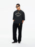 Willy Chavarria Community Center Buffalo Tee in Pirate Black – model view